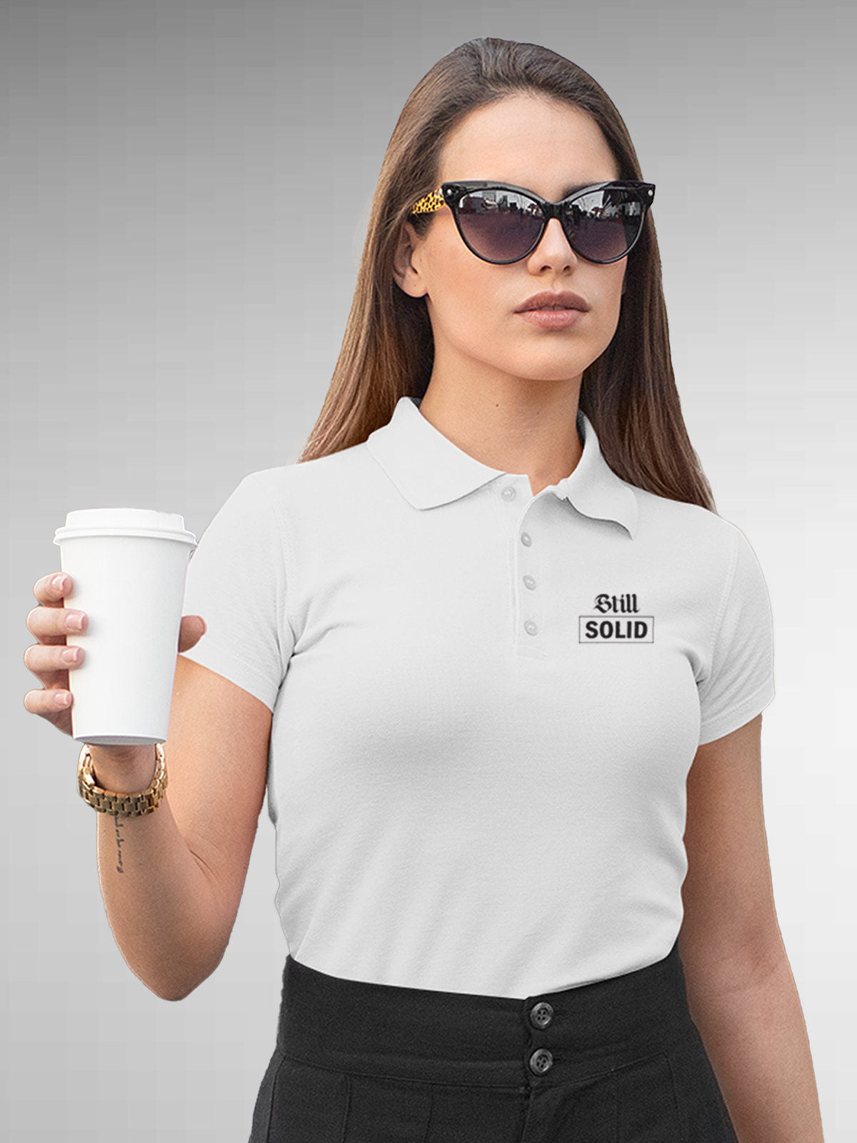 Model wearing Women's White Polo T-shirt with 'Still Solid' design, offering effortless style and premium comfort