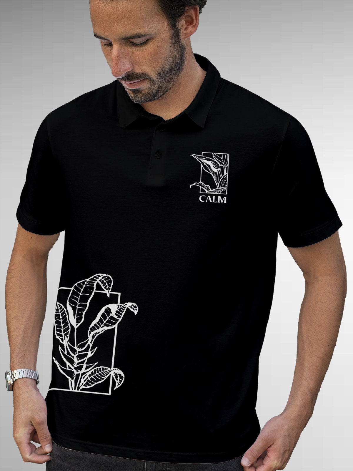 Model wearing Men's Black Polo T-shirt with 'Calm' design, offering effortless style and premium comfort