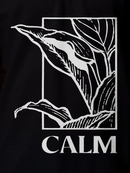 Close up of 'Calm' design on Men's Black Polo T-shirt, highlighting intricate details and vibrant print.