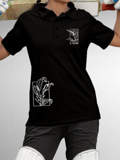 Model wearing Women's Black Polo T-shirt with 'Calm' design, offering effortless style and premium comfort