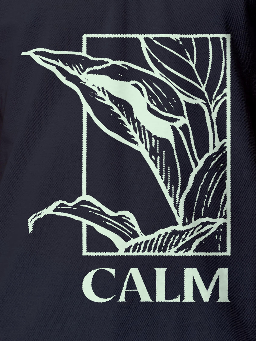 Close up of 'Calm' design on Men's Navy Blue Polo T-shirt, highlighting intricate details and vibrant print.