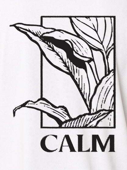 Close up of 'Calm' design on Women's White Polo T-shirt, highlighting intricate details and vibrant print.
