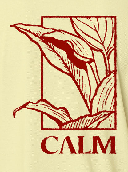 Close up of 'Calm' design on Women's Yellow Polo T-shirt, highlighting intricate details and vibrant print.