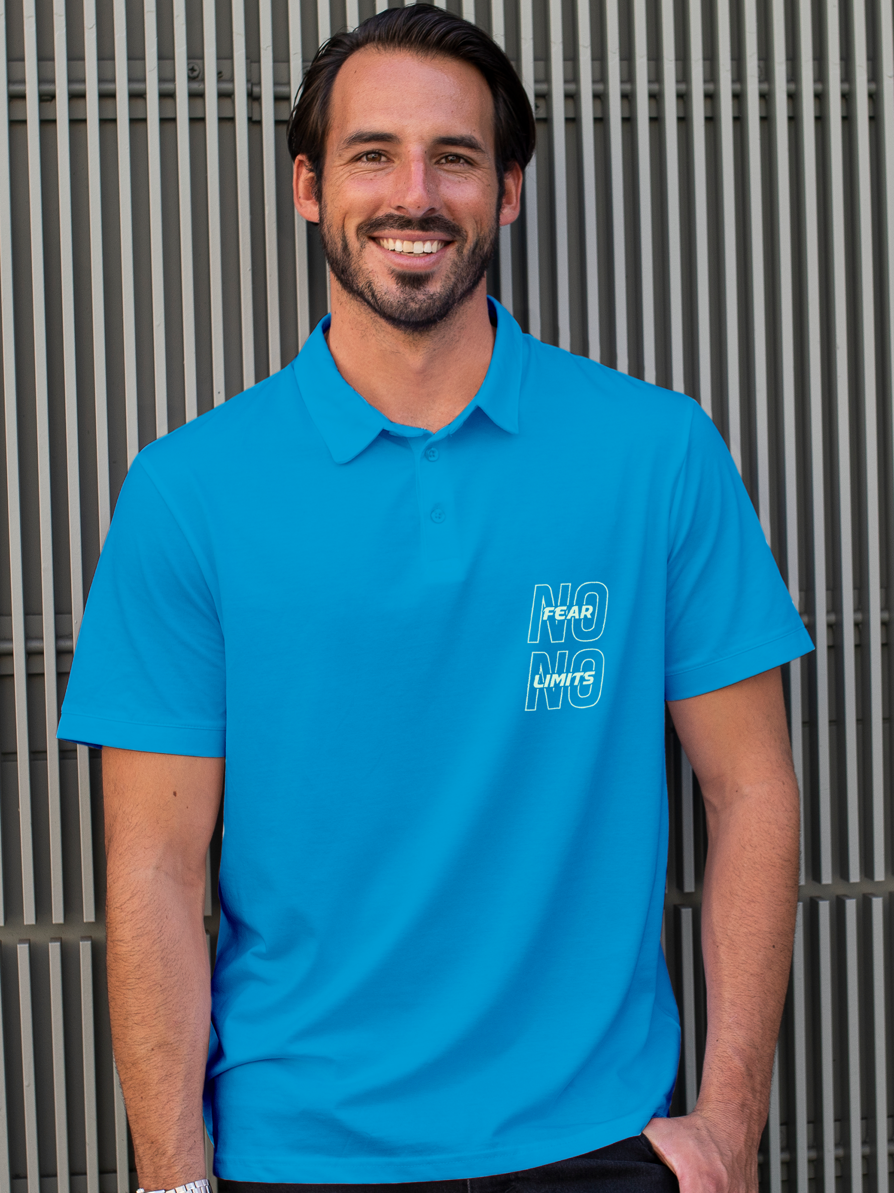 Fighterhero Polo Collection: Model wearing Men's Blue Polo T-shirt with 'No Fear No Limits' design