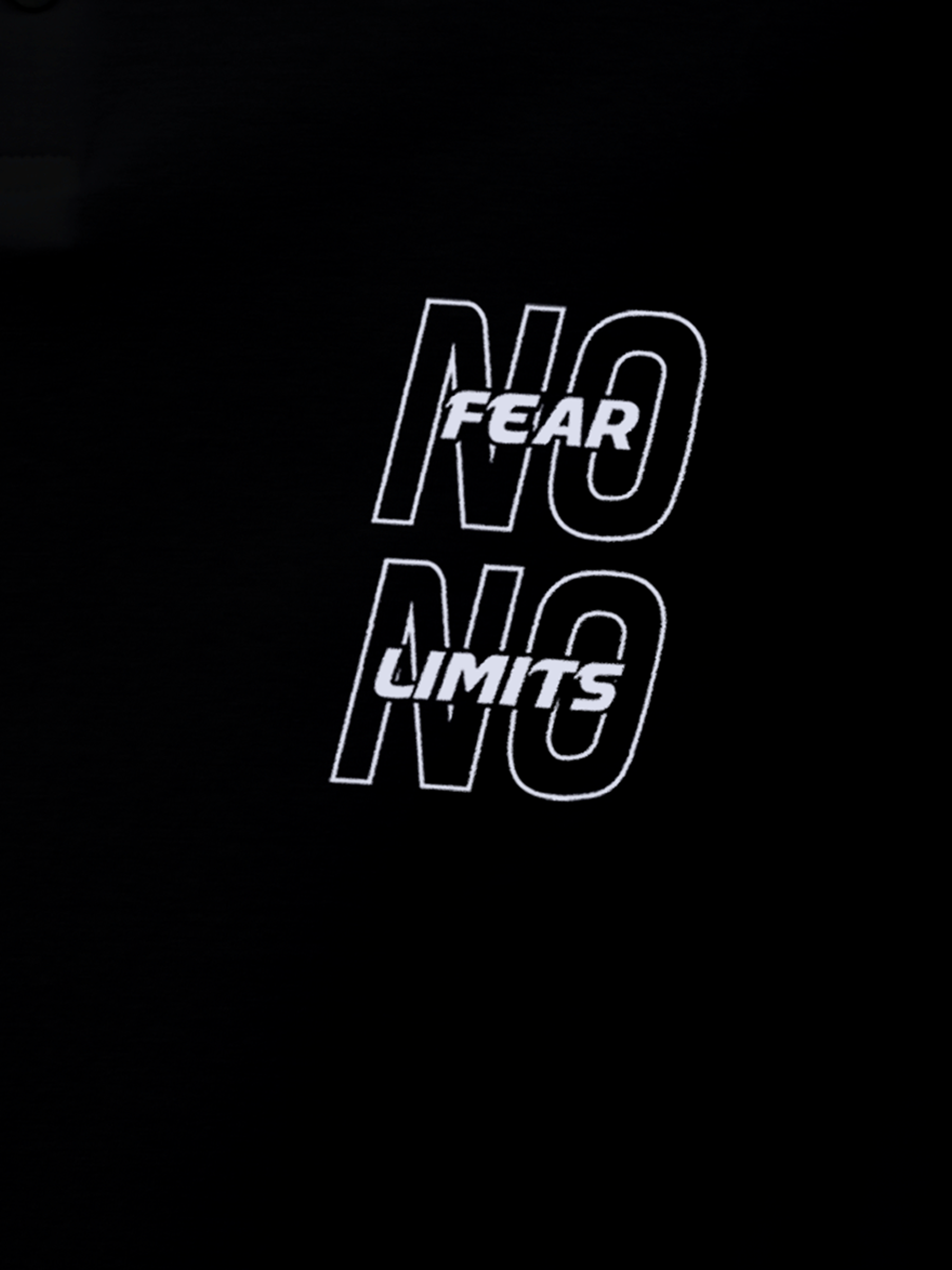 Close up of 'No Fear No Limits' design on Men's Black Polo T-shirt, highlighting intricate details and vibrant print.
