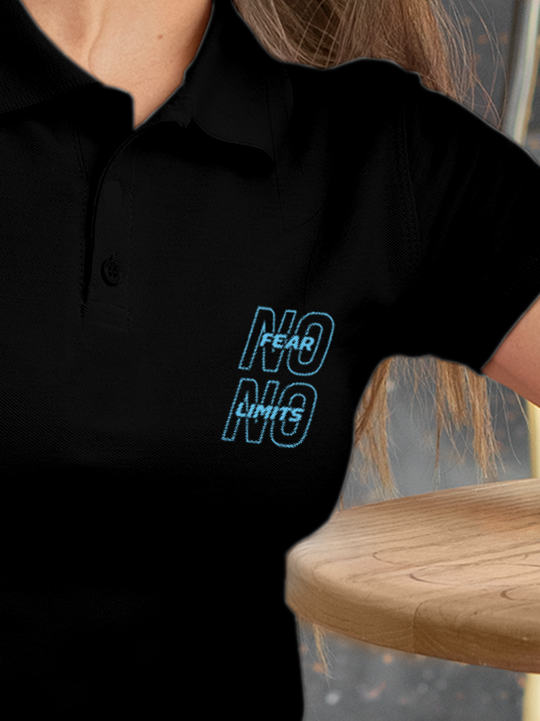 Close up of 'No Fear No Limits' design on Women's Black Polo T-shirt, highlighting intricate details and vibrant print.