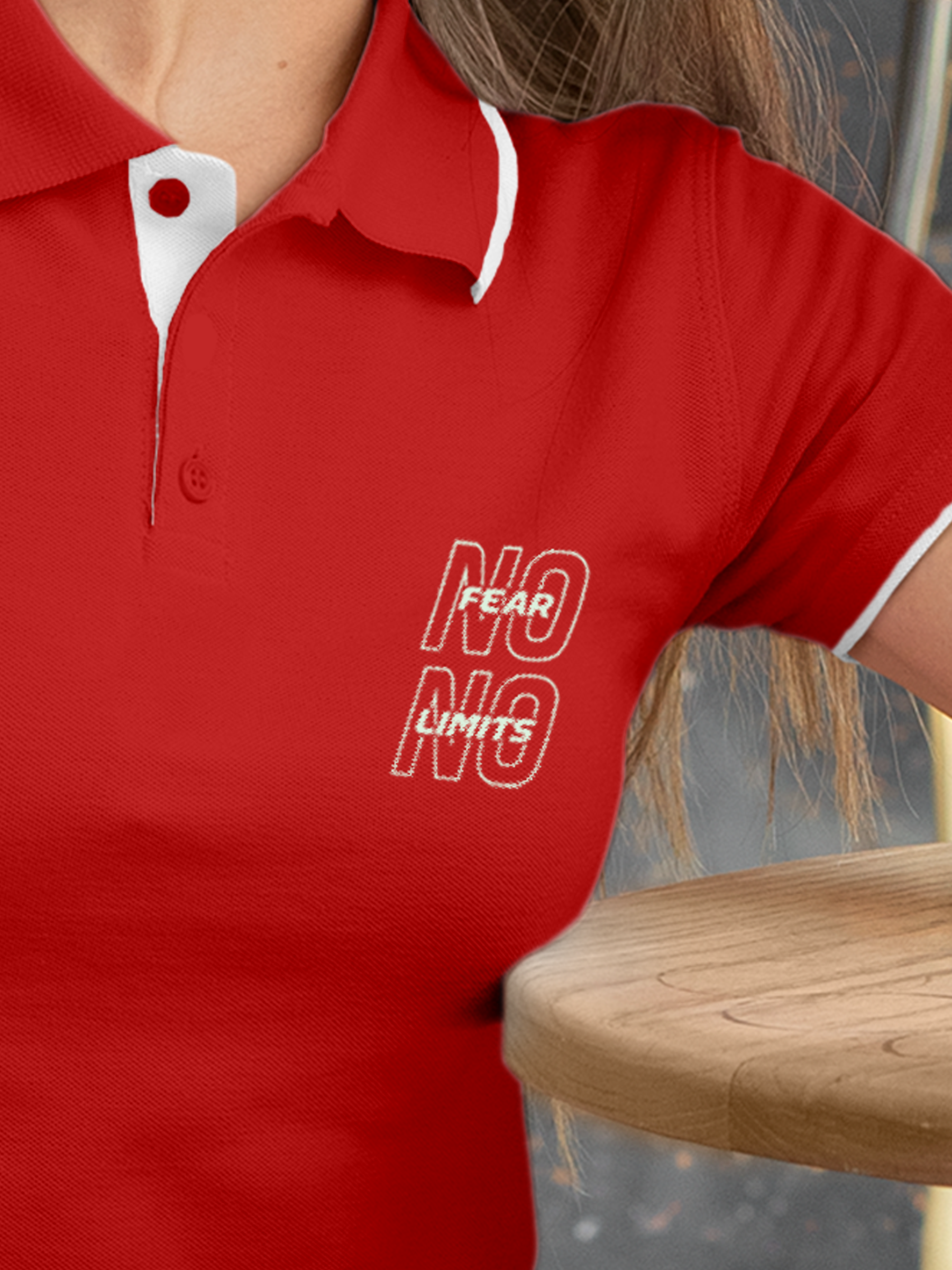 Close up of 'No Fear No Limits' design on Women's Red Polo T-shirt, highlighting intricate details and vibrant print.