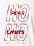 Close up of 'No Fear No Limits' design on Women's White Polo T-shirt, highlighting intricate details and vibrant print.