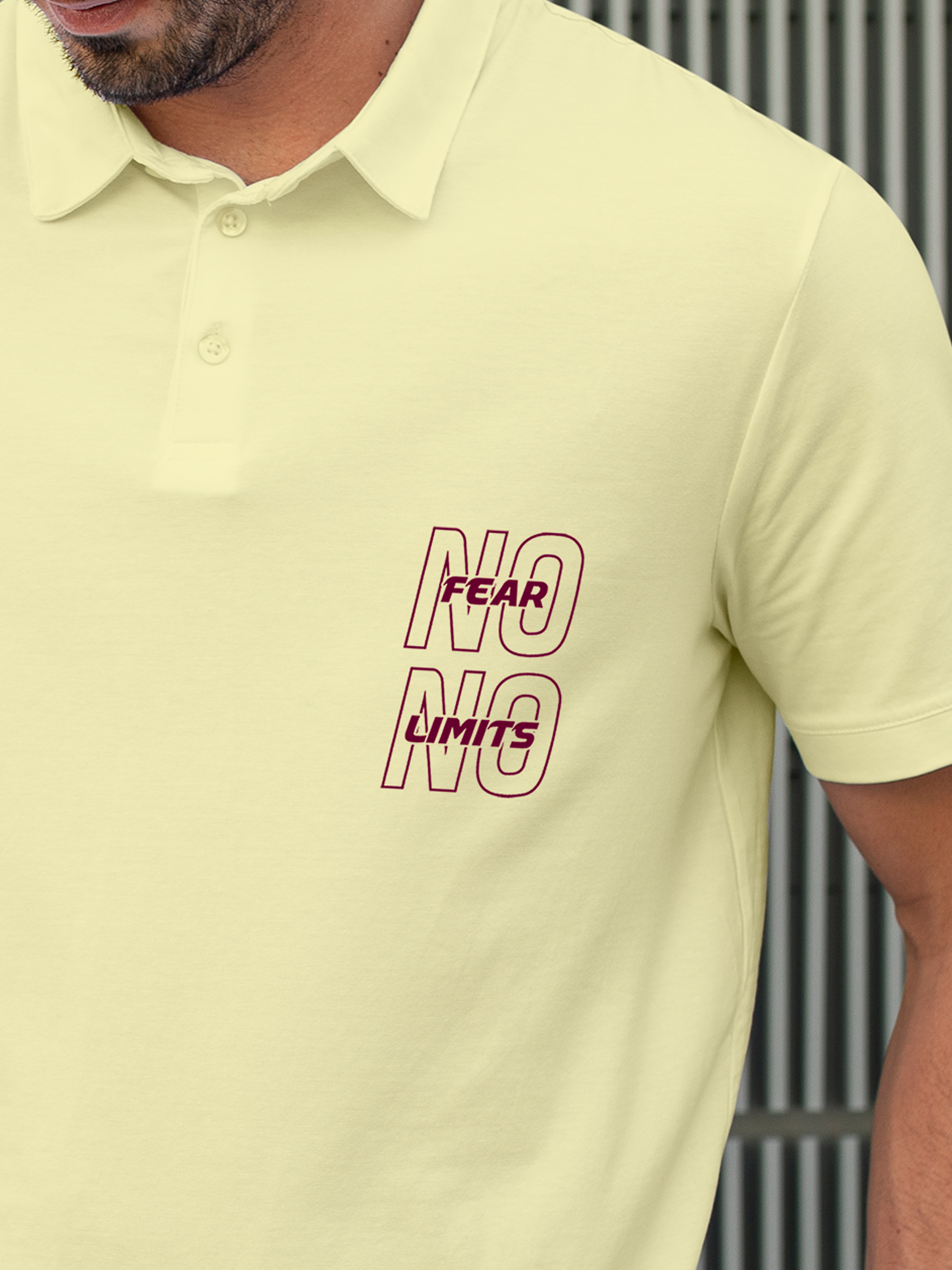 Close up of 'No Fear No Limits' design on Men's Yellow Polo T-shirt, highlighting intricate details and vibrant print.