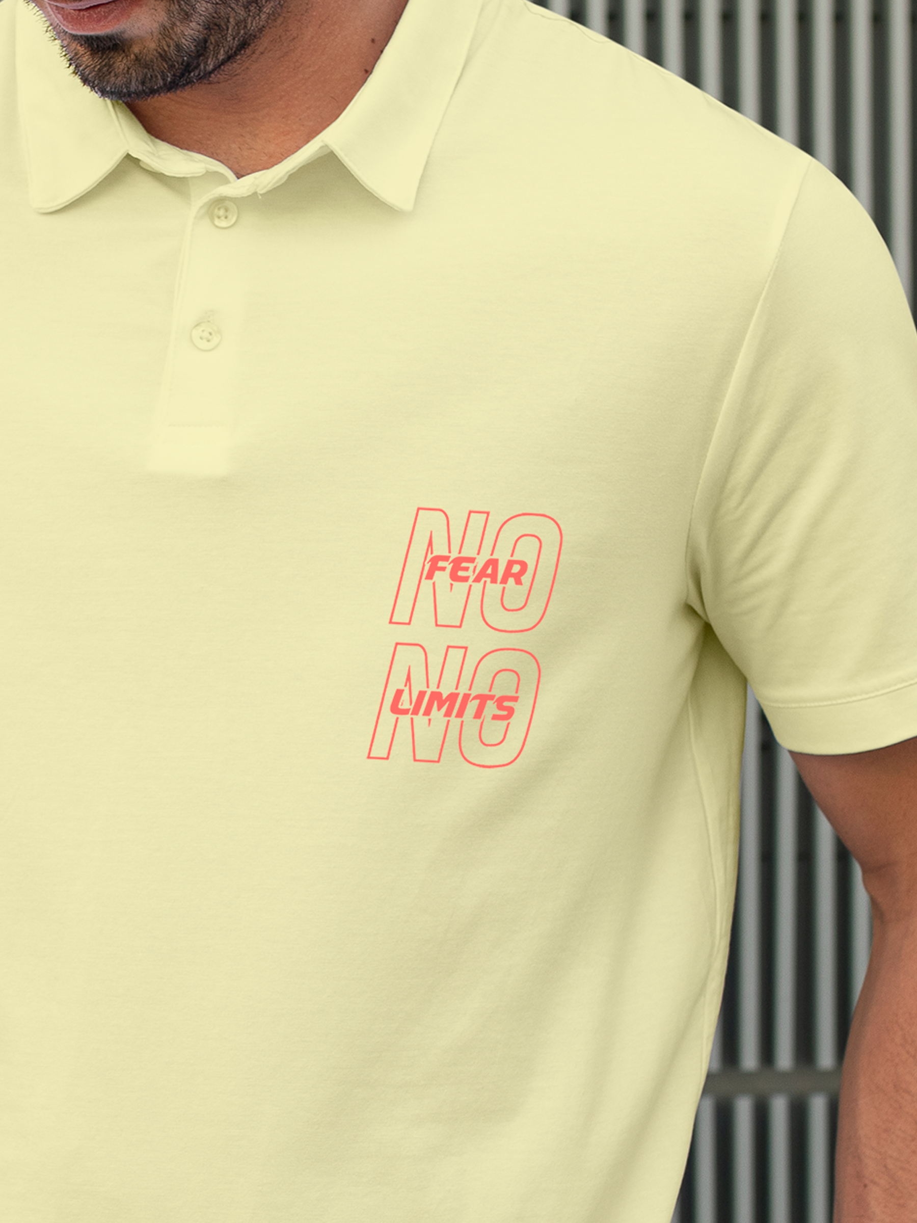 Close up of 'No Fear No Limits' design on Men's Yellow Polo T-shirt, highlighting intricate details and vibrant print.