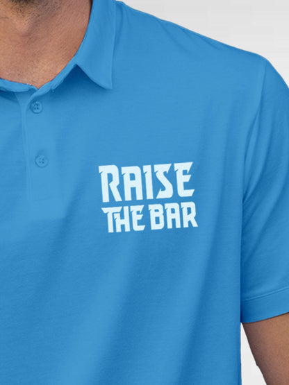 Close up of 'Raise The Bar' design on Men's Blue Polo T-shirt, highlighting intricate details and vibrant print.