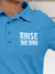 Close up of 'Raise The Bar' design on Women's Blue Polo T-shirt, highlighting intricate details and vibrant print.