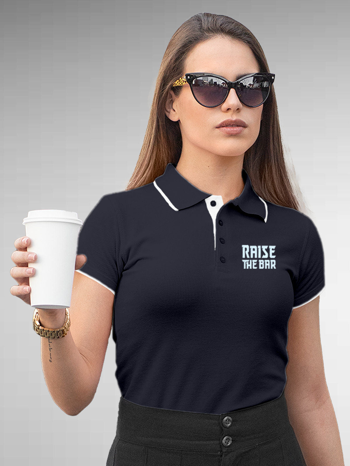 Model wearing Women's Navy Blue Polo T-shirt with 'Raise The Bar' design, offering effortless style and premium comfort