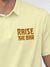 Close up of 'Raise The Bar' design on Men's Yellow Polo T-shirt, highlighting intricate details and vibrant print.