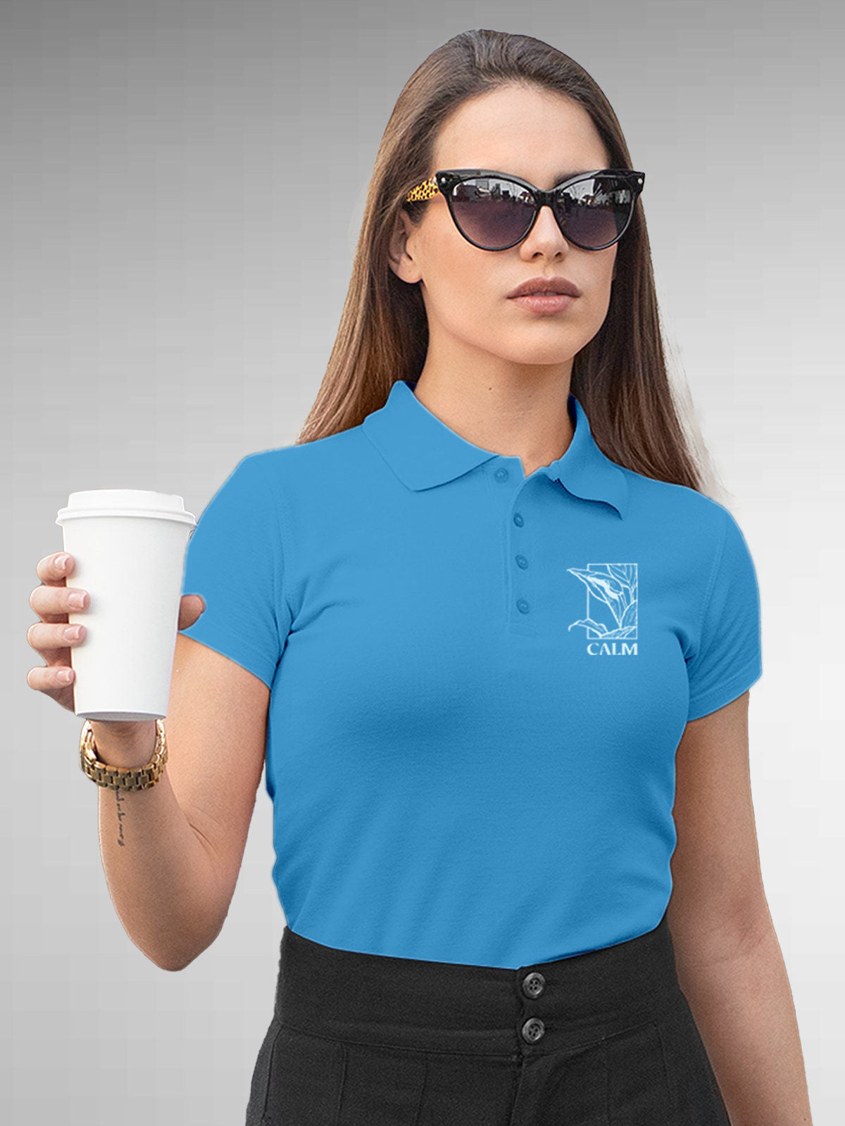 Model wearing Women's Blue Polo T-shirt with 'Calm' design, offering effortless style and premium comfort