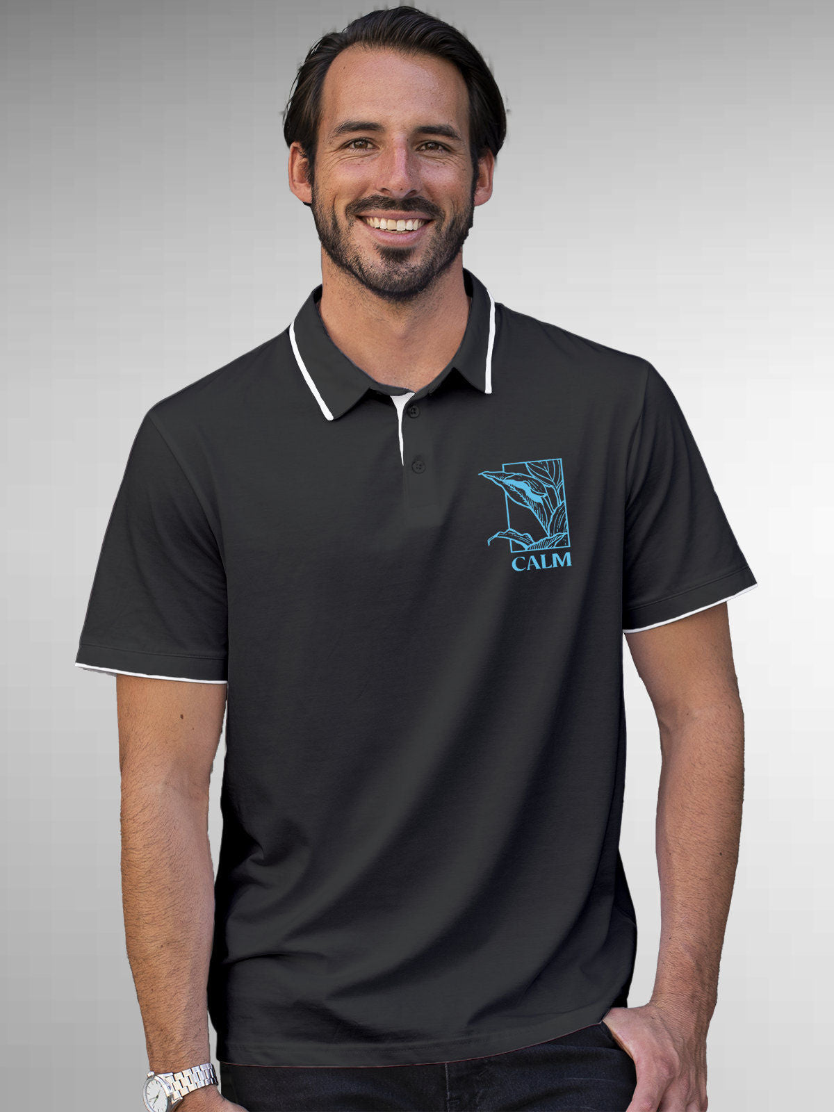 Model wearing Men's Dark Grey Polo T-shirt with 'Calm' design, offering effortless style and premium comfort