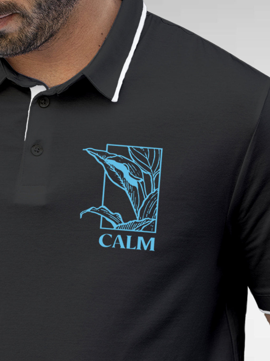 Close up of 'Calm' design on Men's Dark Grey Polo T-shirt, highlighting intricate details and vibrant print.