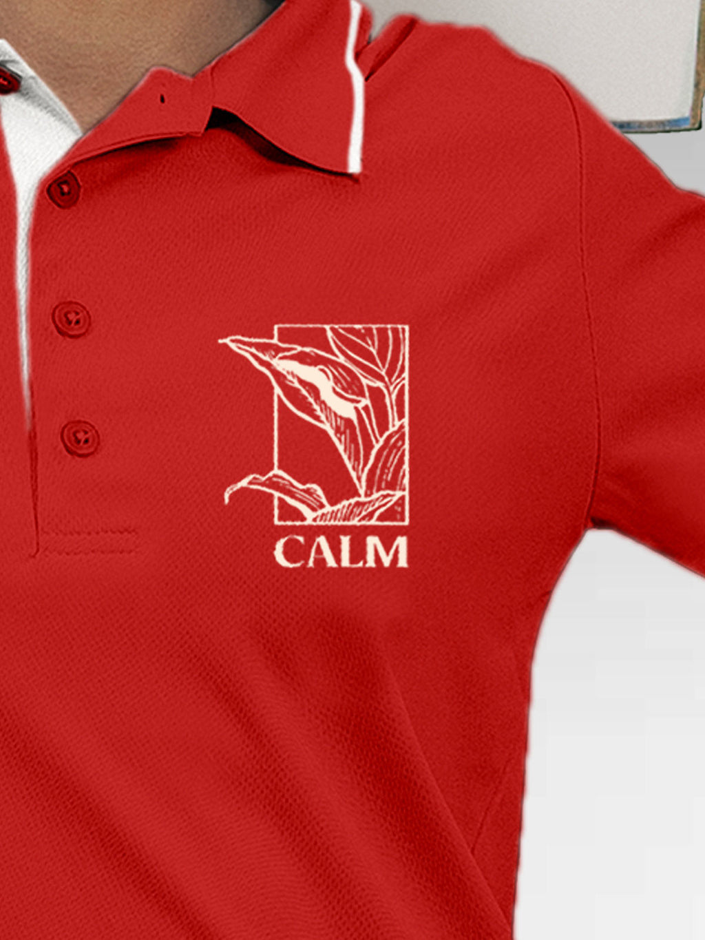 Close up of 'Calm' design on Women's Red Polo T-shirt, highlighting intricate details and vibrant print.