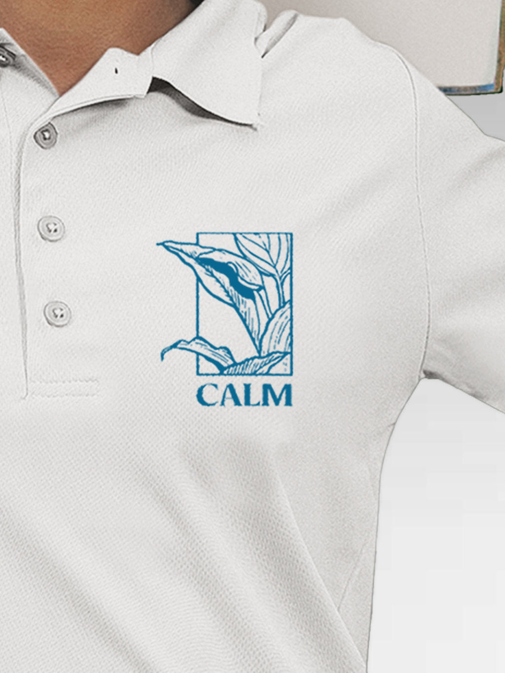 Close up of 'Calm' design on Women's White Polo T-shirt, highlighting intricate details and vibrant print.