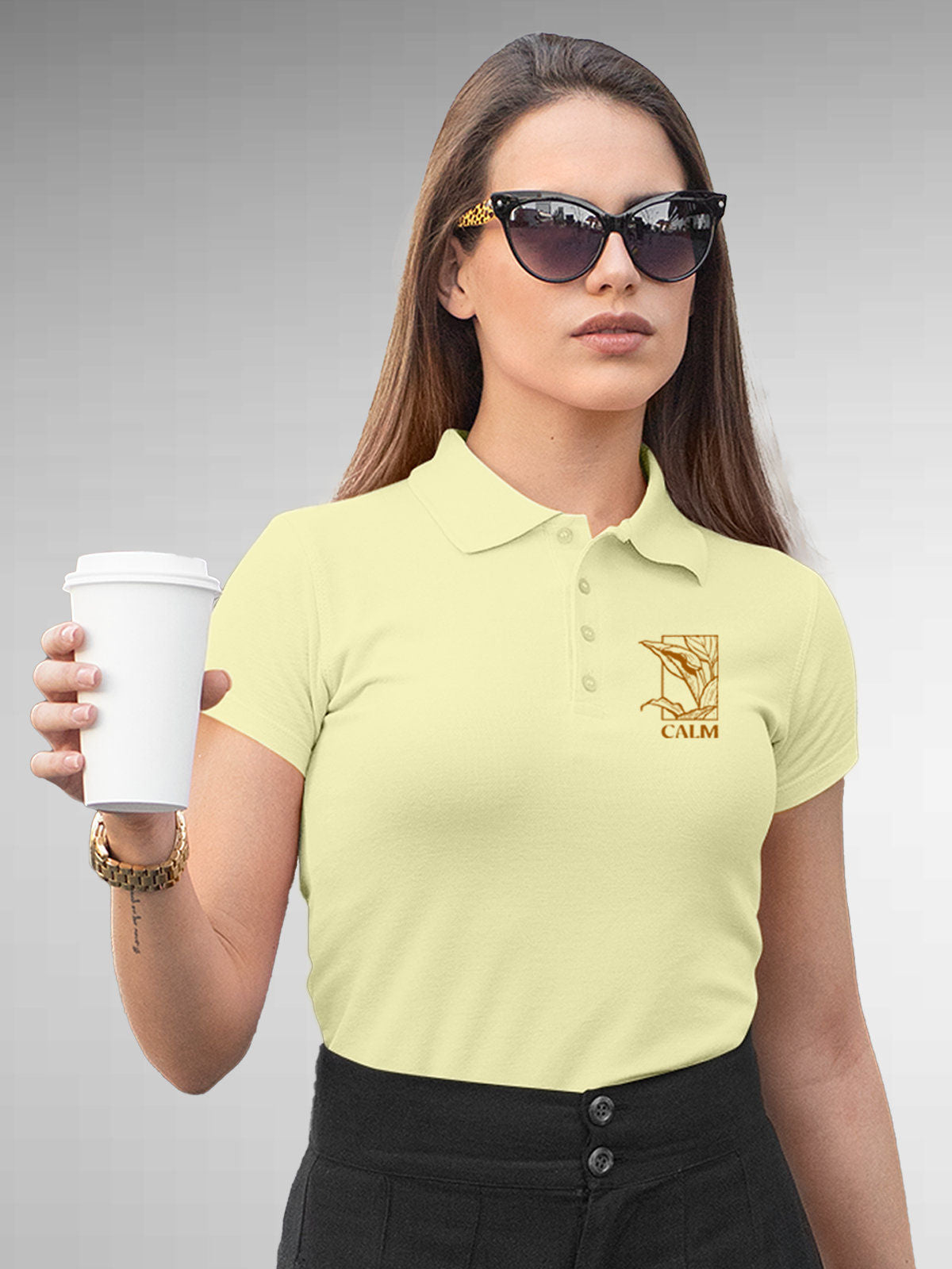 Model wearing Women's Yellow Polo T-shirt with 'Calm' design, offering effortless style and premium comfort