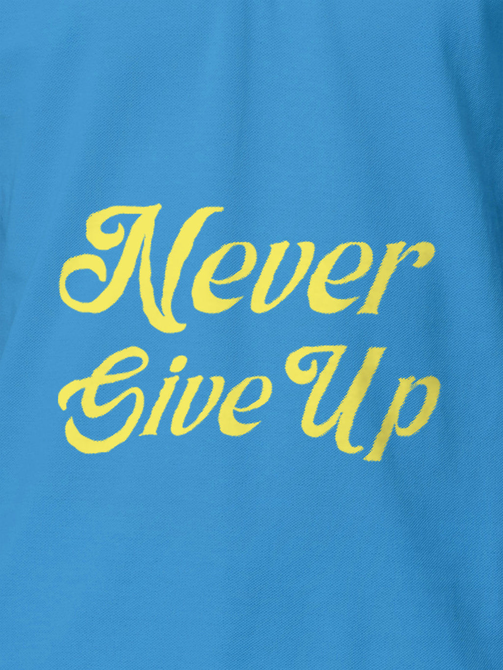 Close up of 'Never Give Up' design on Men's Blue Polo T-shirt, highlighting intricate details and vibrant print.
