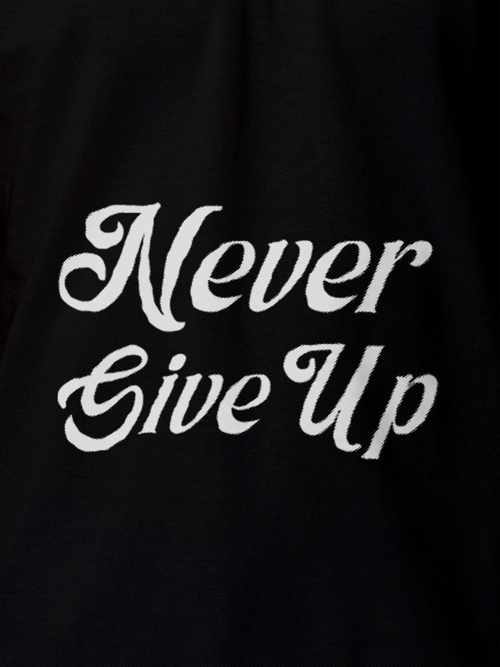 Close up of 'Never Give Up' design on Men's Black Polo T-shirt, highlighting intricate details and vibrant print.