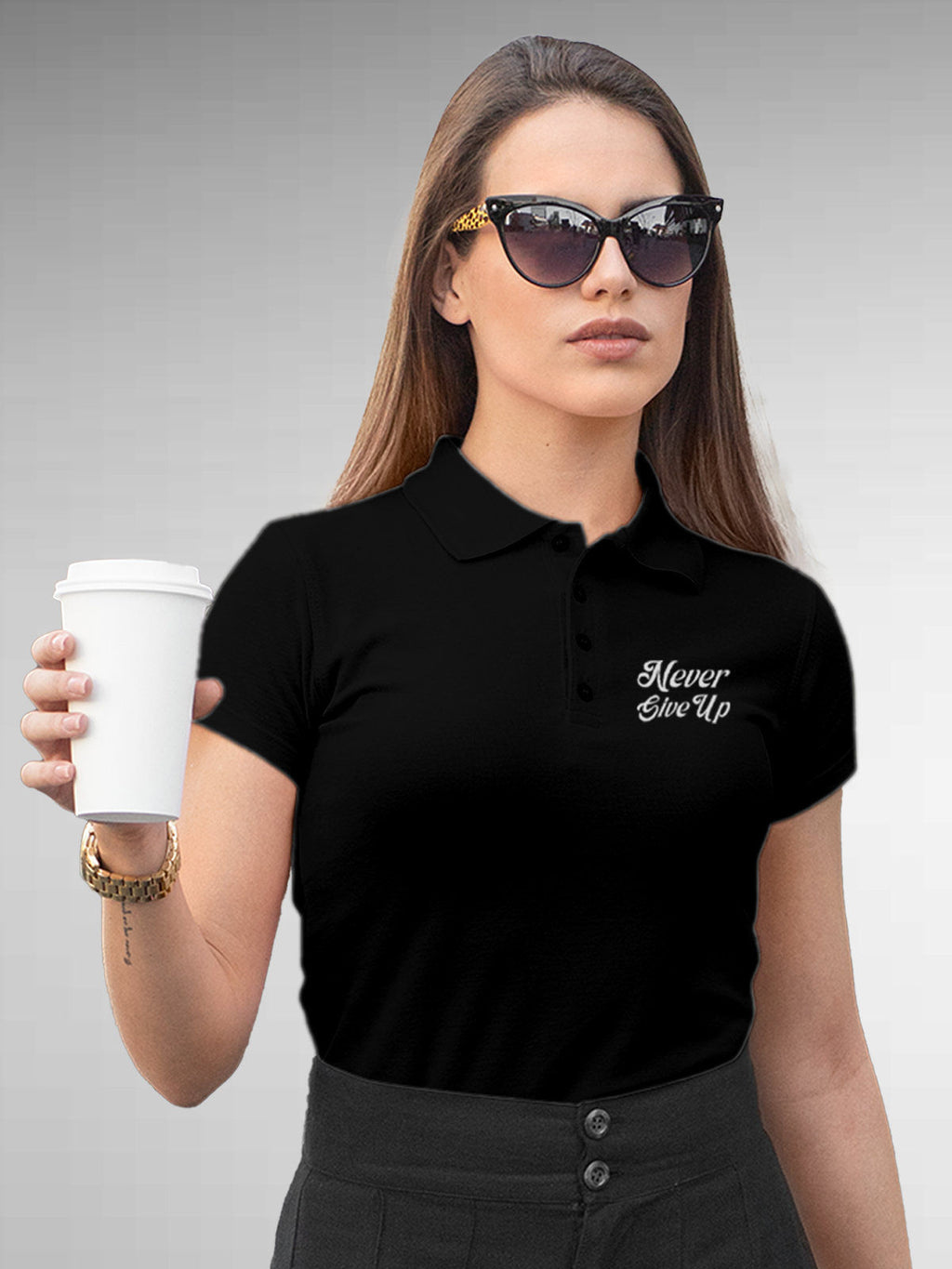 Model wearing Women's Black Polo T-shirt with 'Never Give Up' design, offering effortless style and premium comfort