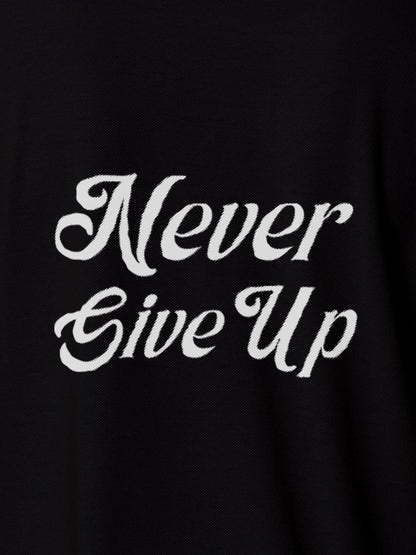 Close up of 'Never Give Up' design on Women's Black Polo T-shirt, highlighting intricate details and vibrant print.