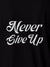 Close up of 'Never Give Up' design on Women's Black Polo T-shirt, highlighting intricate details and vibrant print.