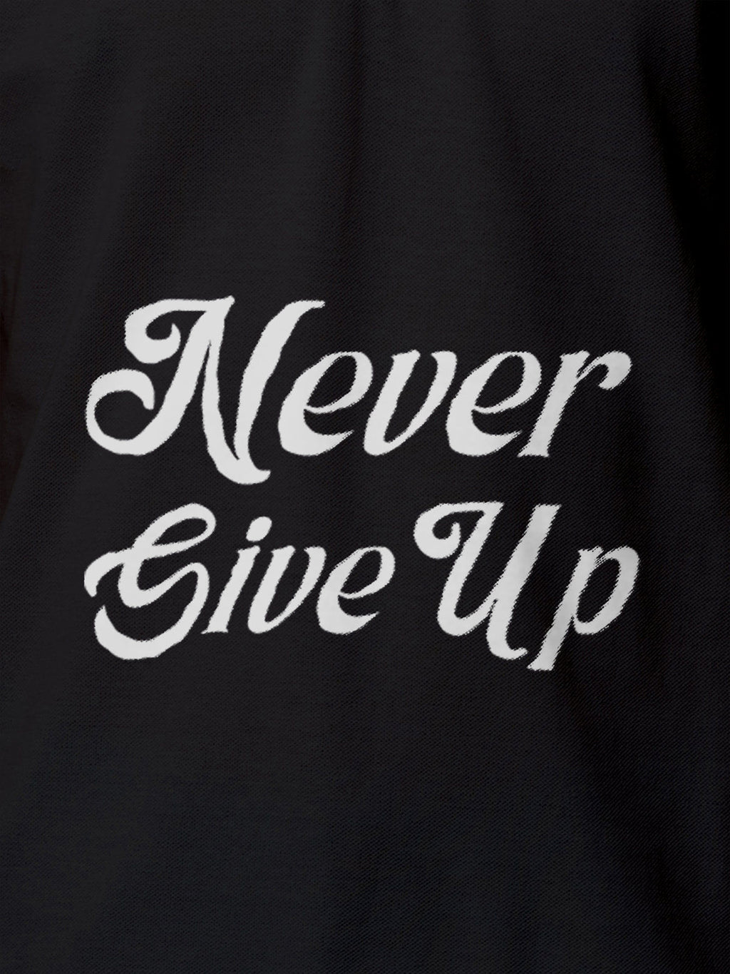 Close up of 'Never Give Up' design on Men's Dark Grey Polo T-shirt, highlighting intricate details and vibrant print.