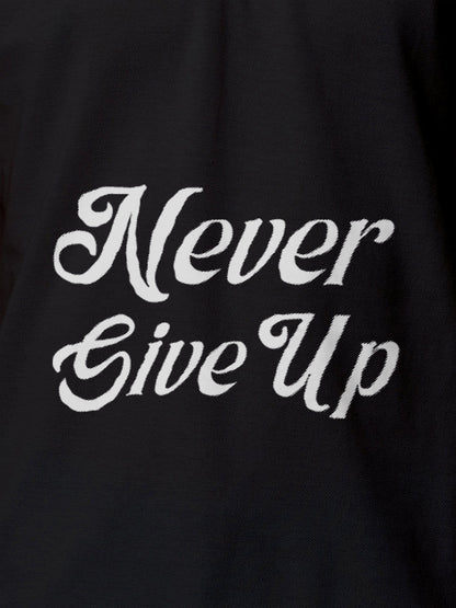 Close up of 'Never Give Up' design on Men's Dark Grey Polo T-shirt, highlighting intricate details and vibrant print.