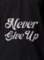 Close up of 'Never Give Up' design on Men's Dark Grey Polo T-shirt, highlighting intricate details and vibrant print.