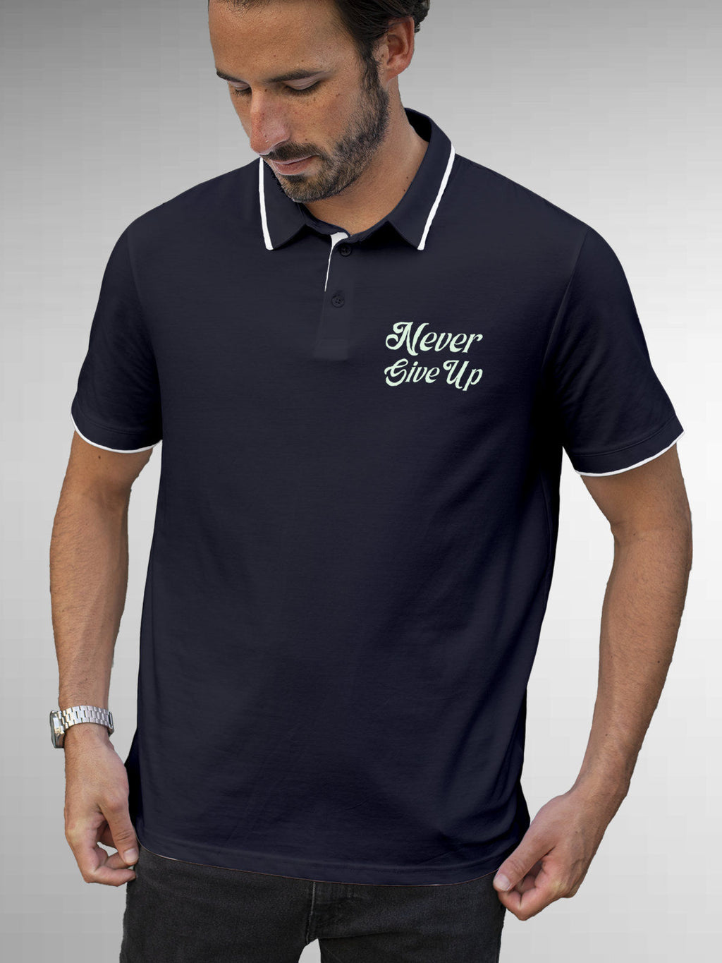 Model wearing Men's Navy Blue Polo T-shirt with 'Never Give Up' design, offering effortless style and premium comfort