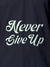 Close up of 'Never Give Up' design on Men's Navy Blue Polo T-shirt, highlighting intricate details and vibrant print.