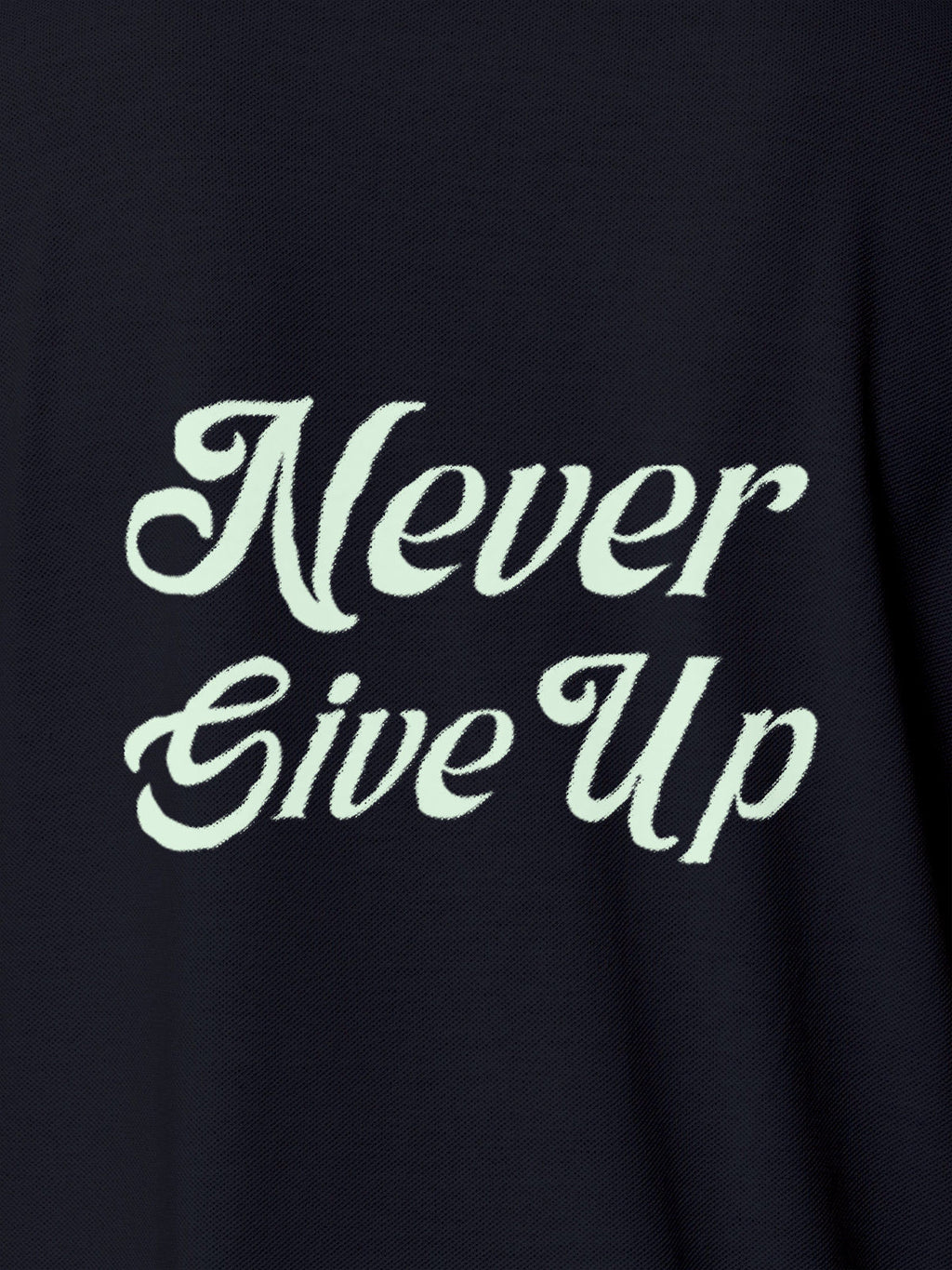 Close up of 'Never Give Up' design on Women's Navy Blue Polo T-shirt, highlighting intricate details and vibrant print.