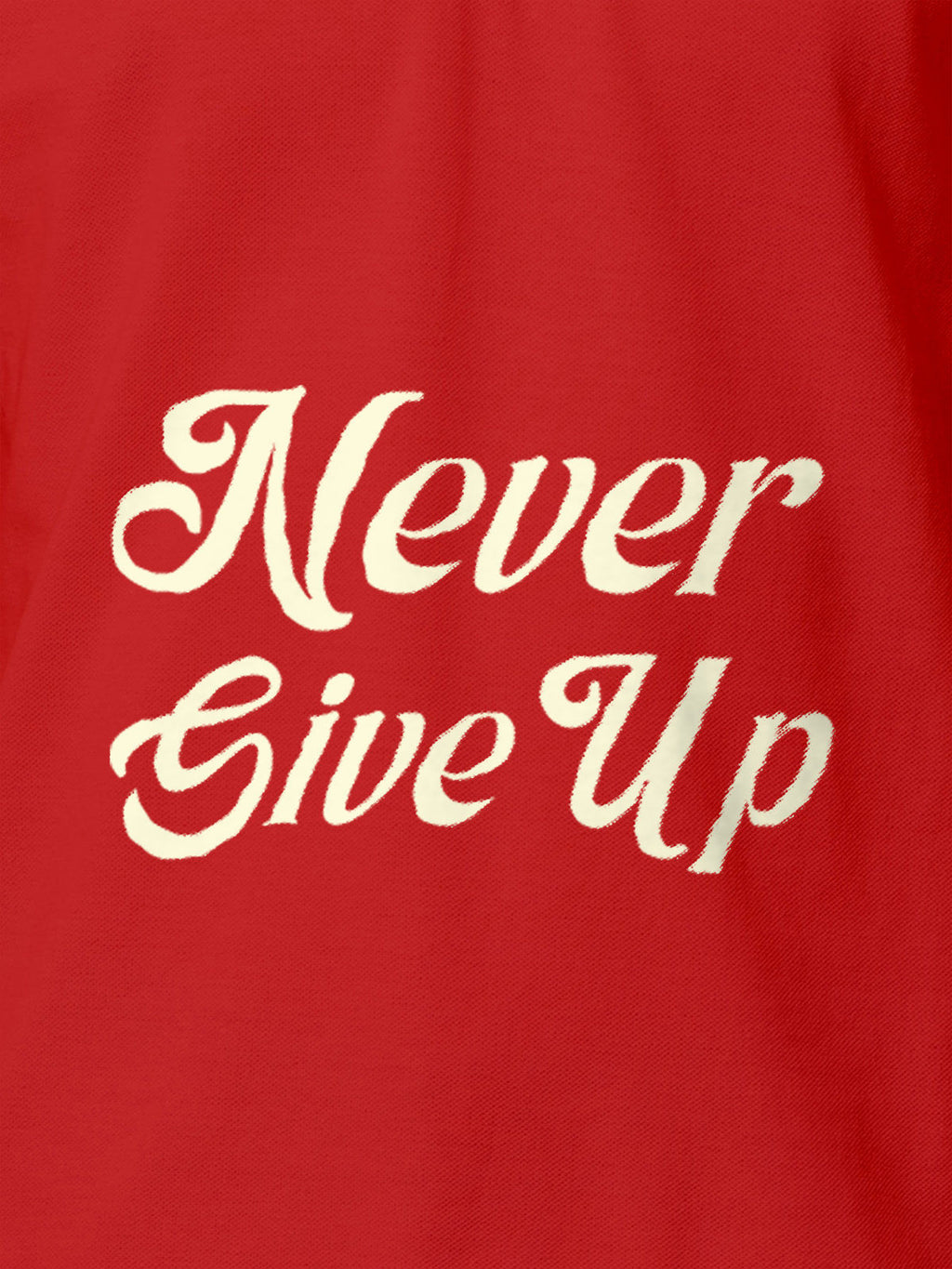 Close up of 'Never Give Up' design on Men's Red Polo T-shirt, highlighting intricate details and vibrant print.