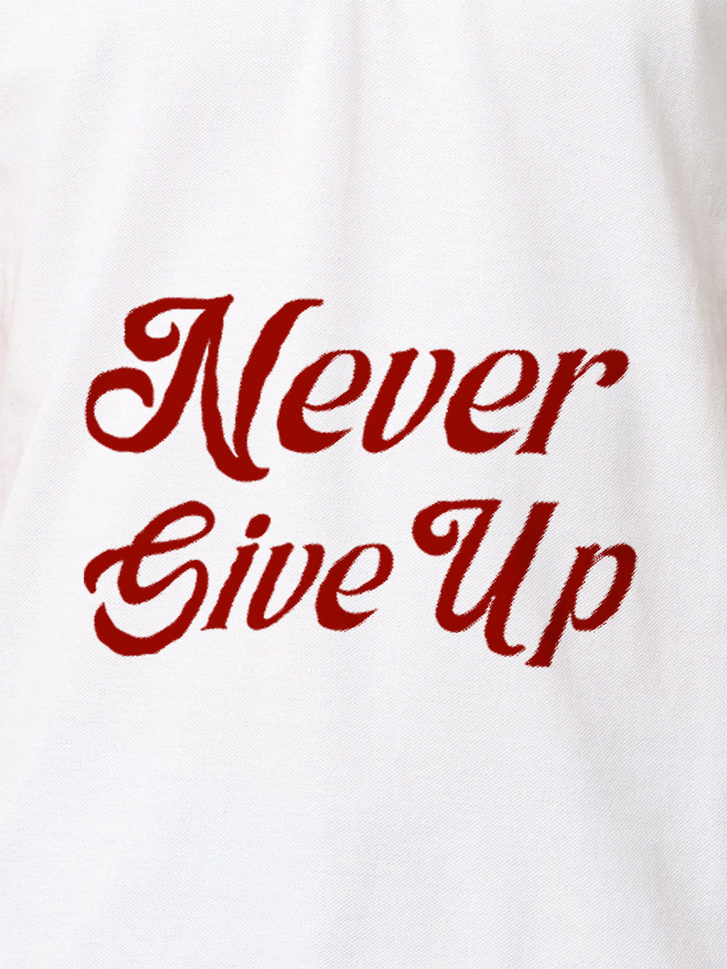 Close up of 'Never Give Up' design on Men's White Polo T-shirt, highlighting intricate details and vibrant print.