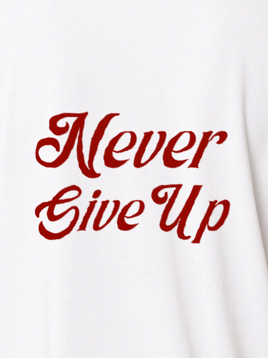Close up of 'Never Give Up' design on Women's White Polo T-shirt, highlighting intricate details and vibrant print.