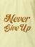 Close up of 'Never Give Up' design on Men's Yellow Polo T-shirt, highlighting intricate details and vibrant print.