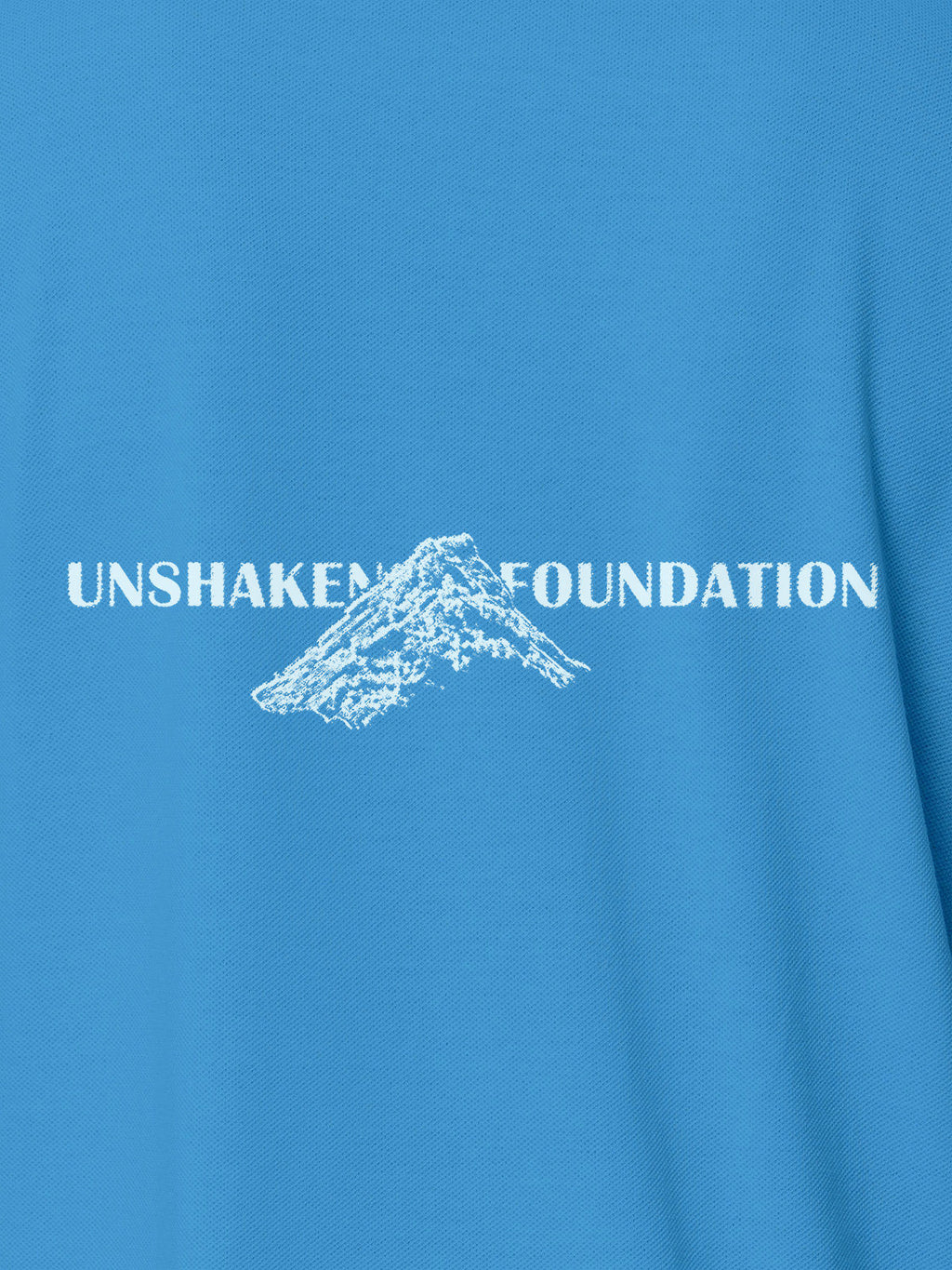 Close up of 'Unshaken Foundation' design on Men's Blue Polo T-shirt, highlighting intricate details and vibrant print.