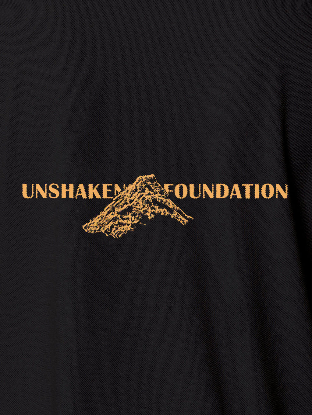 Close up of 'Unshaken Foundation' design on Men's Dark Grey Polo T-shirt, highlighting intricate details and vibrant print.