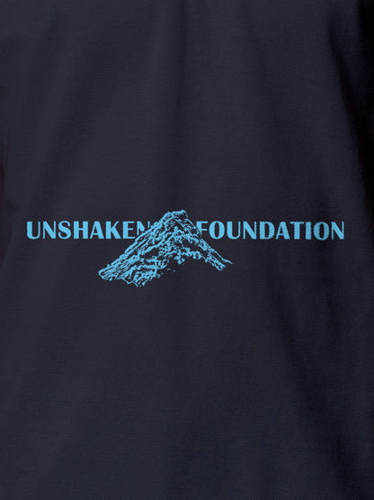 Close up of 'Unshaken Foundation' design on Women's Navy Blue Polo T-shirt, highlighting intricate details and vibrant print.