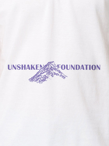 Close up of 'Unshaken Foundation' design on Women's White Polo T-shirt, highlighting intricate details and vibrant print.
