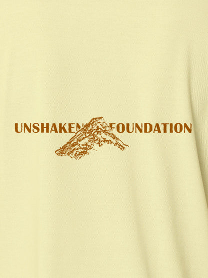 Close up of 'Unshaken Foundation' design on Men's Yellow Polo T-shirt, highlighting intricate details and vibrant print.