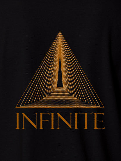 Close up of 'Go Infinite' design on Women's Black Polo T-shirt, highlighting intricate details and vibrant print.
