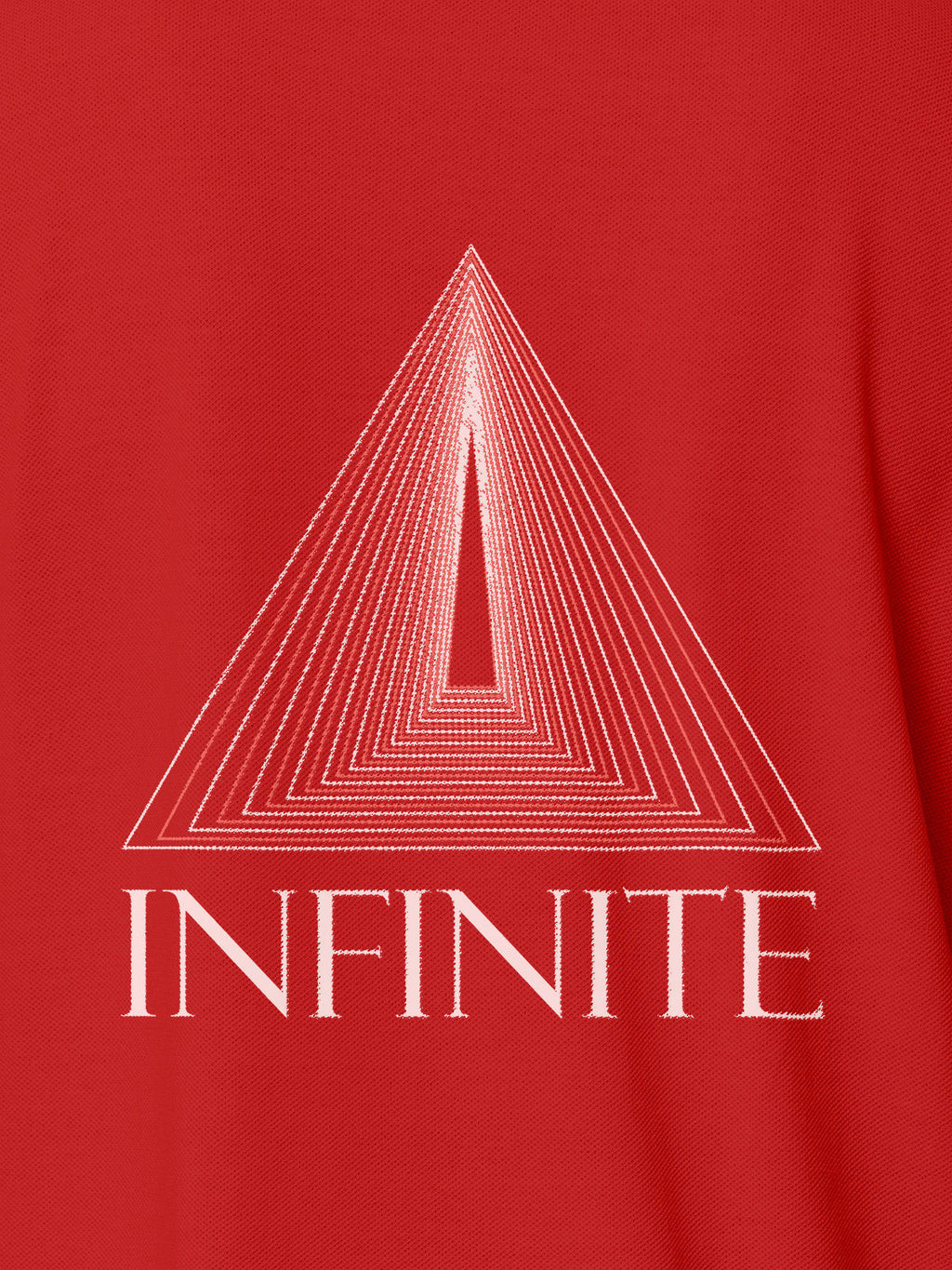 Close up of 'Go Infinite' design on Women's Red Polo T-shirt, highlighting intricate details and vibrant print.
