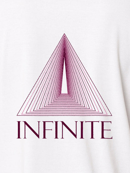 Close up of 'Go Infinite' design on Women's White Polo T-shirt, highlighting intricate details and vibrant print.