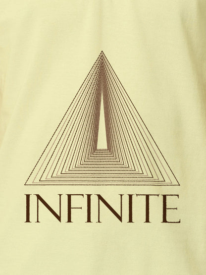 Close up of 'Go Infinite' design on Men's Yellow Polo T-shirt, highlighting intricate details and vibrant print.
