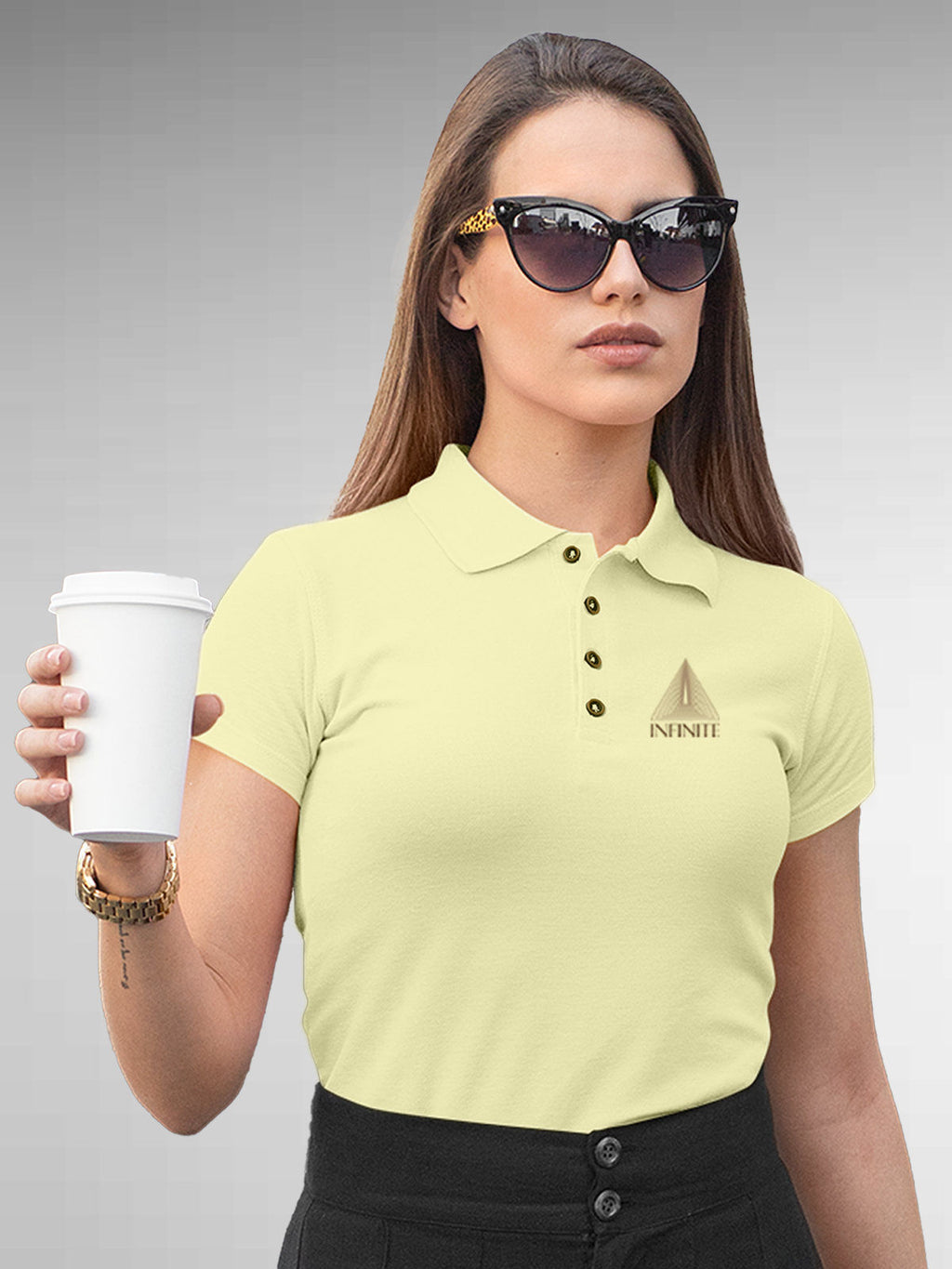 Model wearing Women's Yellow Polo T-shirt with 'Go Infinite' design, offering effortless style and premium comfort