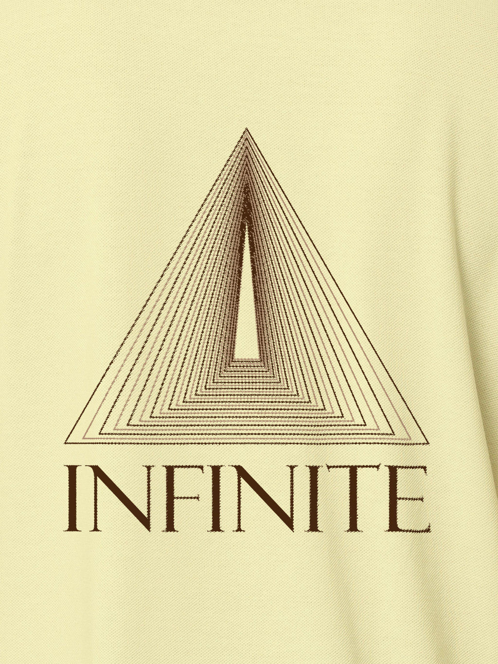 Close up of 'Go Infinite' design on Women's Yellow Polo T-shirt, highlighting intricate details and vibrant print.